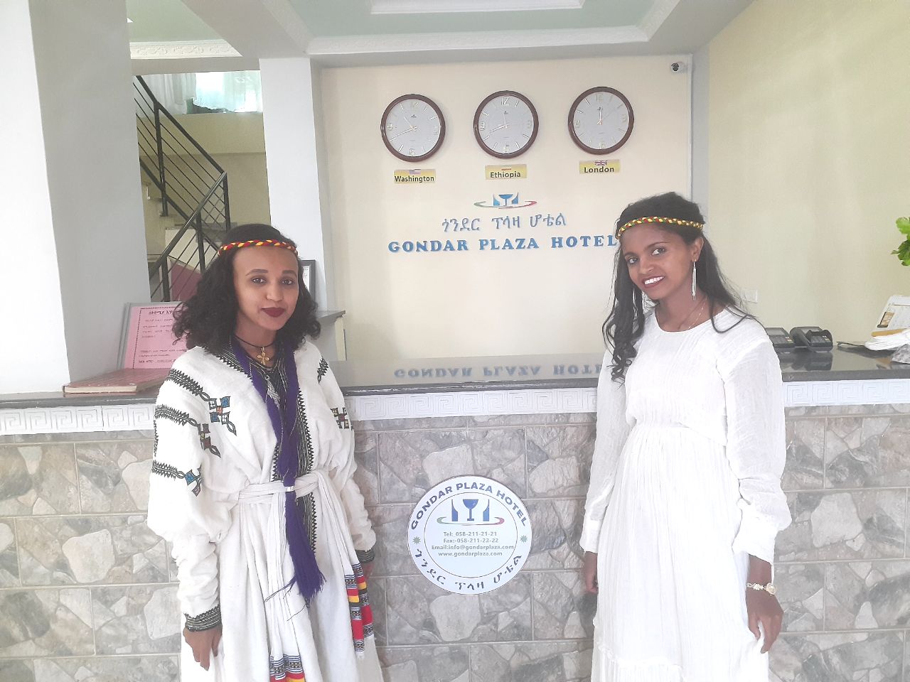 Staff in traditional dress at reception